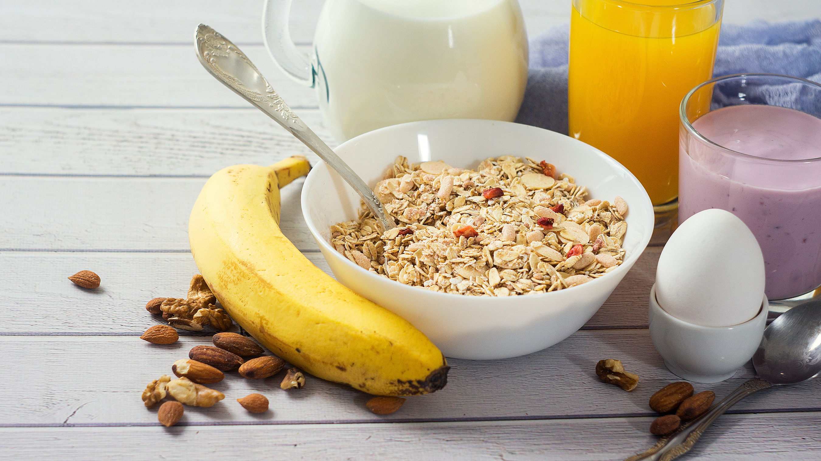 Healthy breakfast with fruit, yogurt smoothie, and whole grains