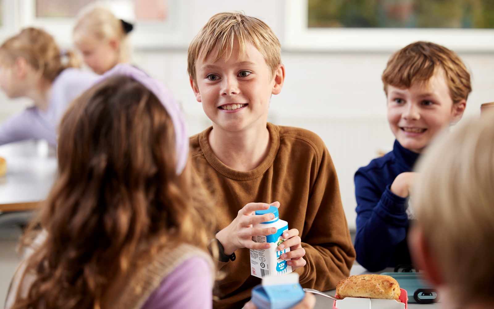 Children drinking milk during lunch break